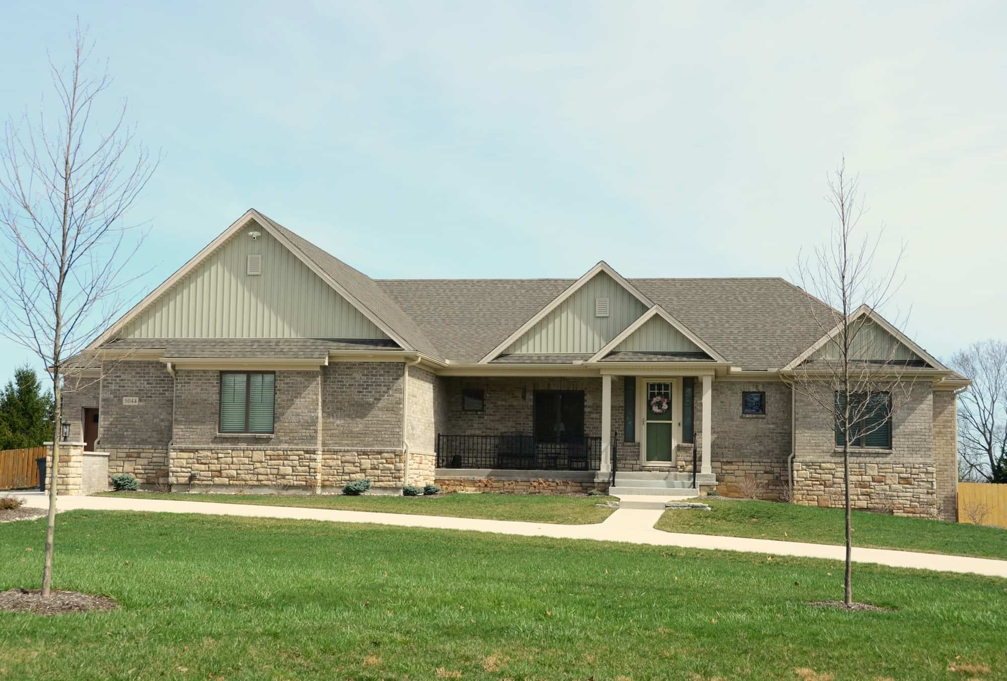 Single-storey house with a covered front porch and a green lawn
